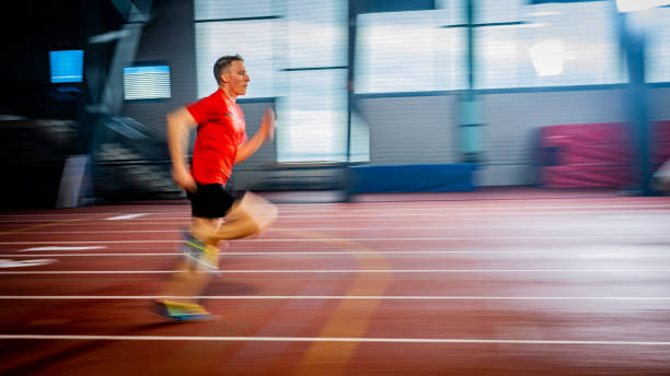 istock Athlete  running fast at stadium track 1490896020