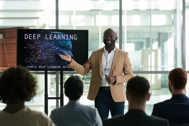 istock Happy young confident teacher or lecturer pointing at interactive board 1490896276