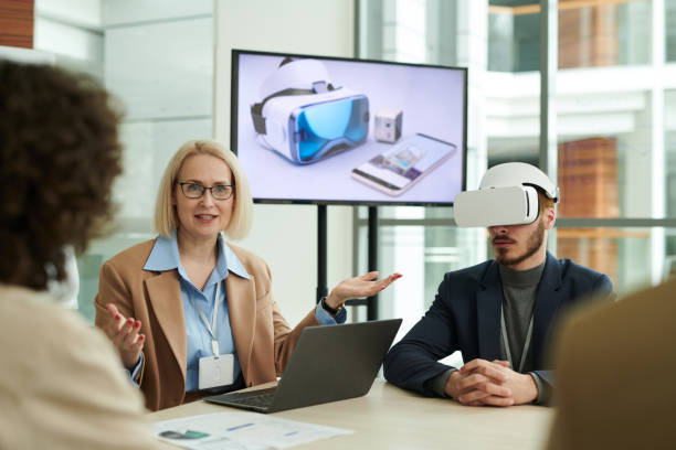 istock Confident mature business coach explaining something to employees 1490896423