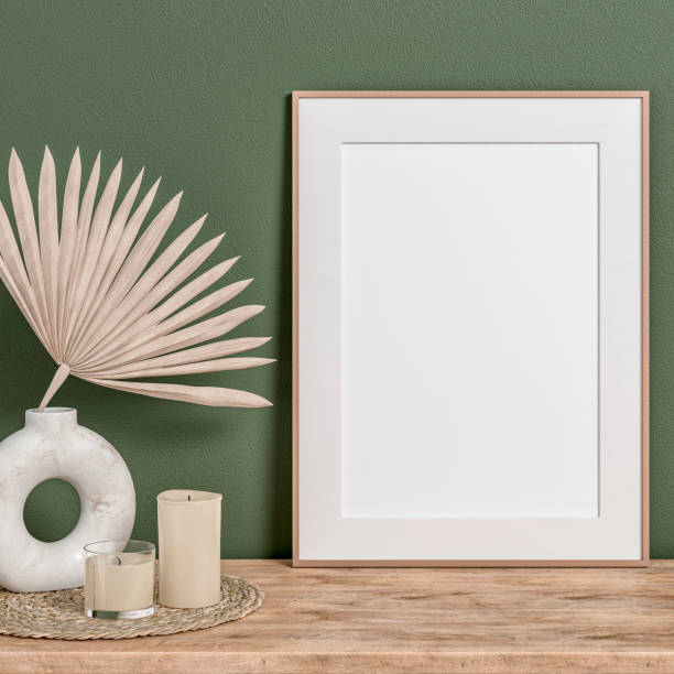 istock Simple interior with a cabinet and a large rectangle picture frame and the 50s- 60s decoration (candles on a place mat) 1490896637