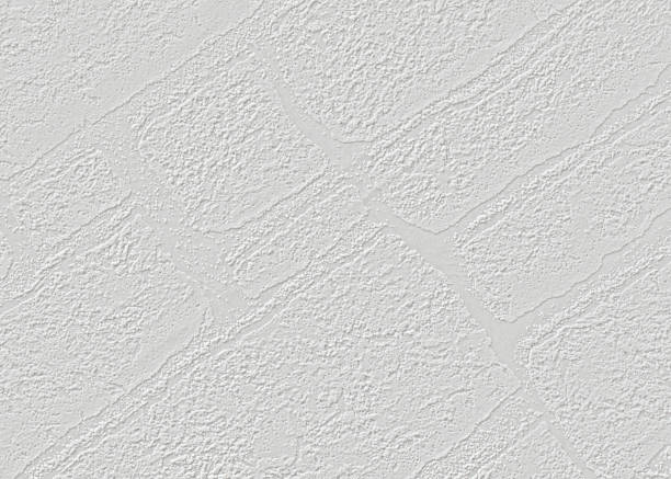 istock On a light gray paper wallpaper with a texture of bricks arranged diagonally. 1490896739