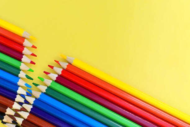 istock Colored pencils for drawing are depicted on a yellow background. The pencils are sharpened. A great set for drawing. 1490897449