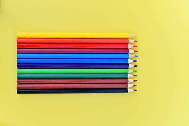 istock Colored pencils for drawing are depicted on a yellow background. The pencils are sharpened. A great set for drawing. 1490897475