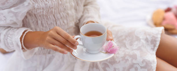 istock Summer Tea Picnic: Close-up of Female Hands With Cup o Tea 1490897977