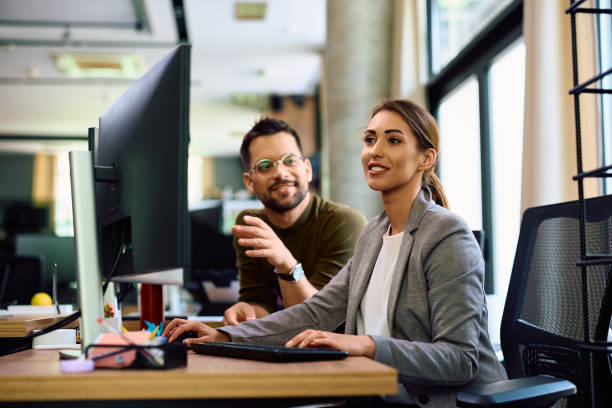 istock Young graphic designers cooperating while working on desktop PC in the office. 1490898095