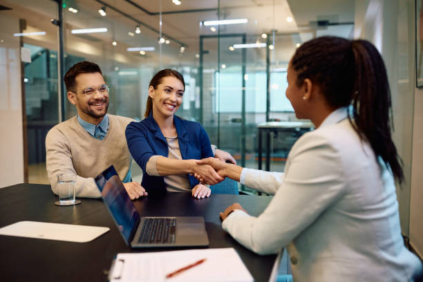 istock Happy couple greeting their financial advisor in the office. 1490898201