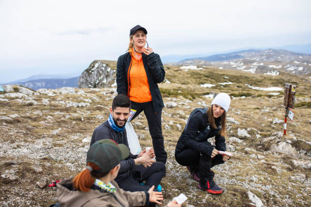 istock Friends having a great time on the mountain top 1490902236