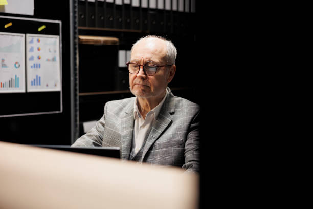 istock Businessman inspecting quarterly results 1490905517