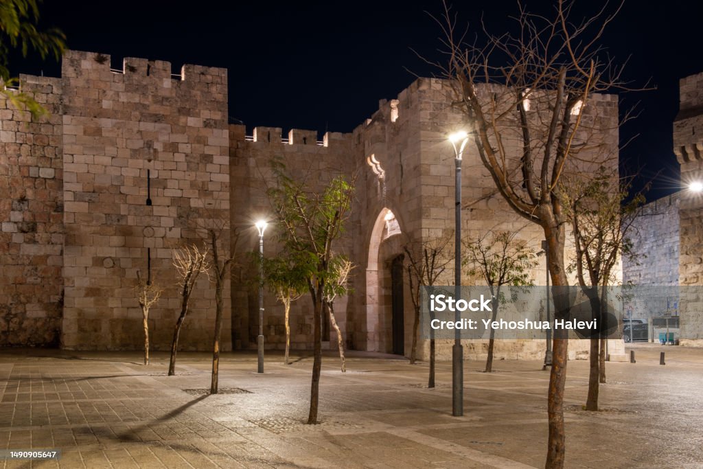 Jerusalem's Jaffa Gate at night Twilight view of the outside of the Jaffa Gate to the Old City of Jerusalem. Ancient Stock Photo