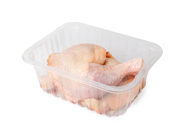 istock Raw Chicken Legs in a Plastic Container Isolated, Fresh Chicken Quarter on White Background 1490907430