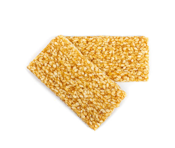 istock Sesame Snack Isolated, Honey Seed Cracker, Sesame Candy Bar on White Background 1490907482