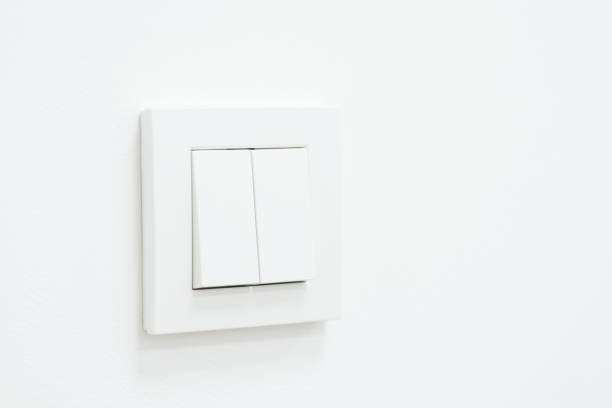 istock Minimalist photo of a white light switch on a wall 1490907560