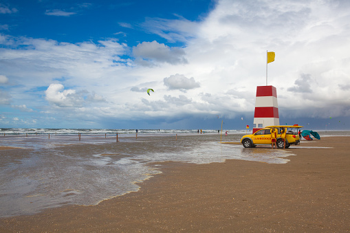 Wadden Sea National Park, Denmark - August 11,2018: Coastguard on the Lakolk beach after heavy rain. This beach is  beach after heavy rain, Jutland, Denmark. This beach is favorite for kiteboarding, surfing etc.