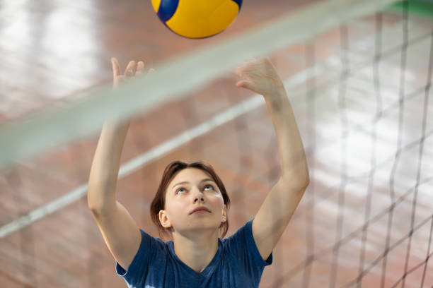 istock Girl learning to play volleyball 1490911897