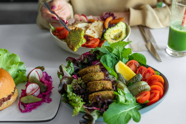 istock Falafel from chickpeas with lettuce salad, tomatoes, lemon slices 1490913111