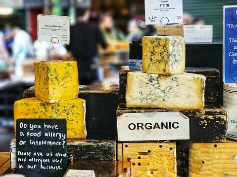 Organic Stilton cheese on display and for sale at the food market.