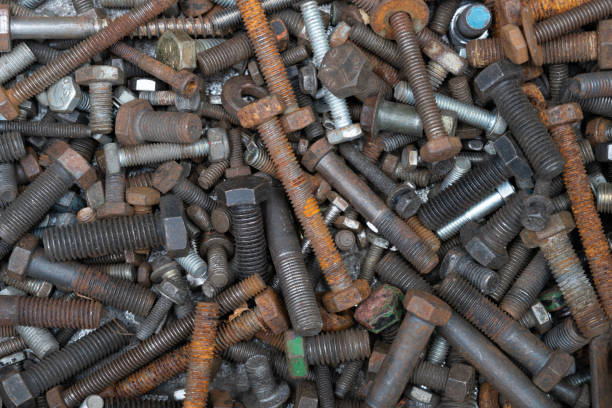 istock close up of different old metallic bolts and nuts, engineering tools and equipment concept 1490915687