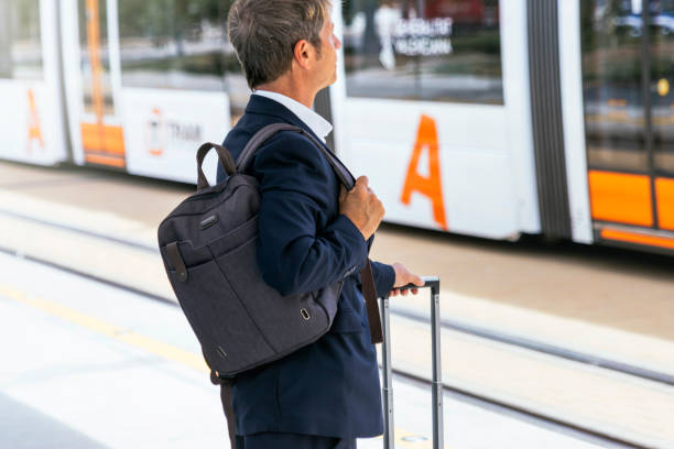 istock Businessman teleworking. The Jet-Setting Professional: A Middle-Aged Businessman Balancing Business and Travel 1490916059