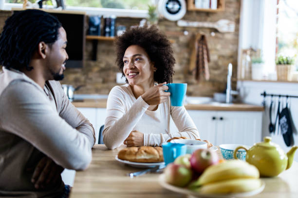 istock Young happy black couple communicating while enjoying in their coffee time. 1490916654
