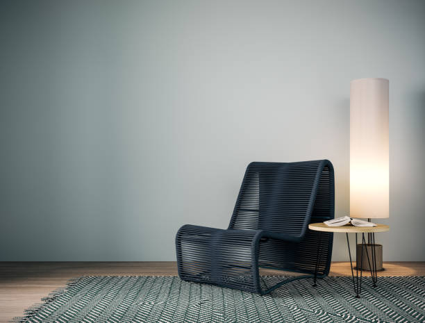 istock Modern interior with blue armchair and floor lamp in front of empty blue wall background. 1490916707