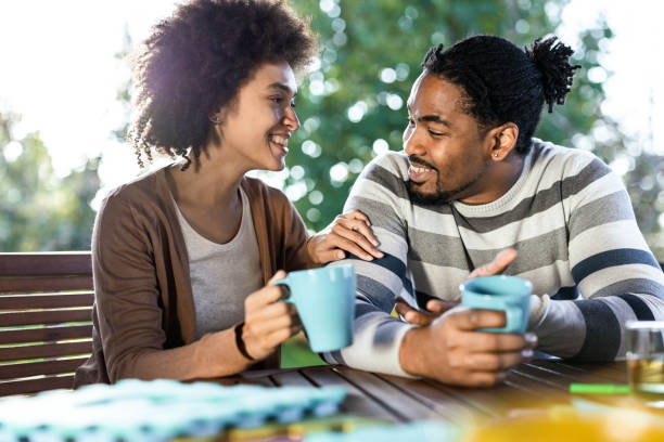 istock Happy black couple talking during coffee time on a terrace. 1490916899