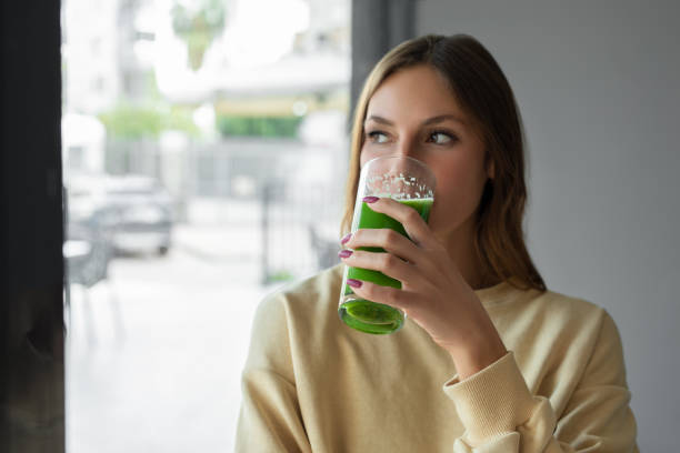 istock Woman drinking detox juice 1490917962