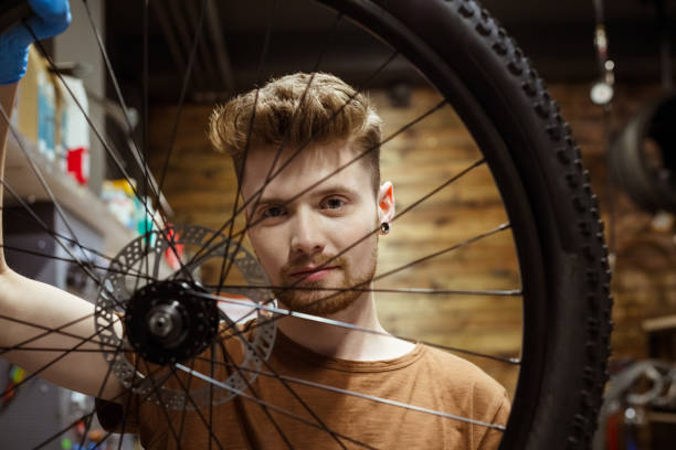 istock Portrait of serviceman holding bicycle wheel 1490918260