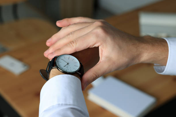 istock Man checking time in office, closeup. Being late 1490921374