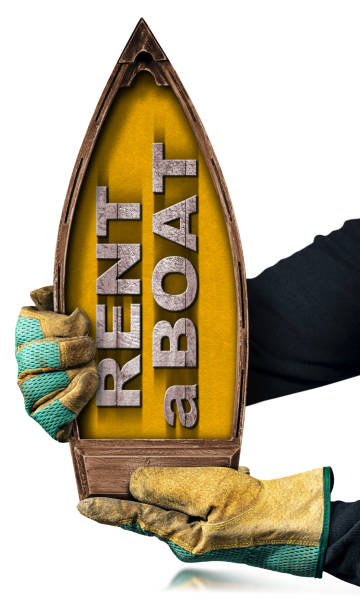 istock Hands Holding a Small Wooden Boat with Text Rent a Boat 1490922950