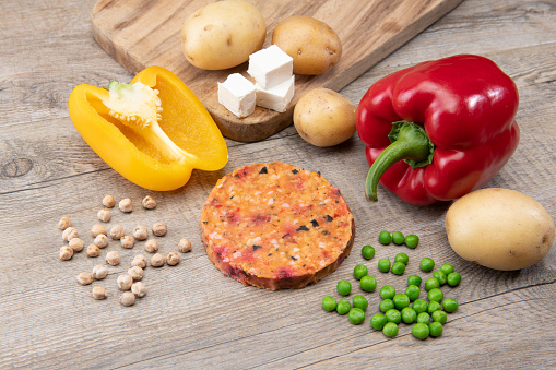 Vegan burger ingredients isolated on a  table (bell pepper and peas)