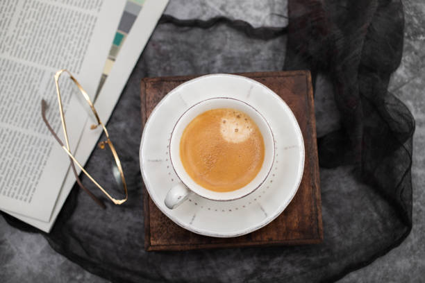 istock Newspapers and coffee cup, with reading glasses. 1490927157