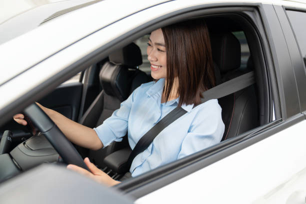 istock Young Asian woman with car 1490927972