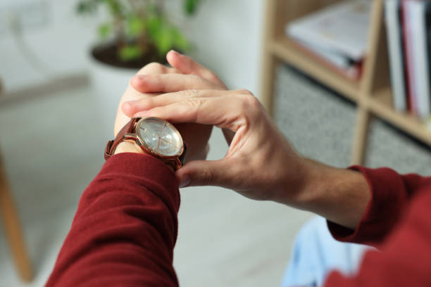 istock Man checking time in room, closeup. Being late 1490933168