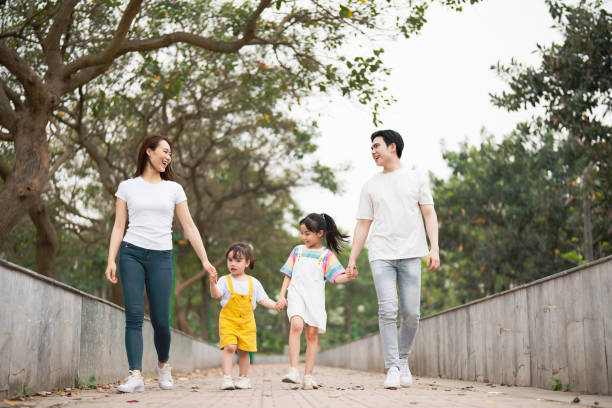 istock Young Asian family in the park 1490935444
