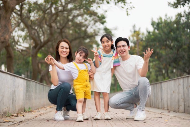 Young Asian family in the park