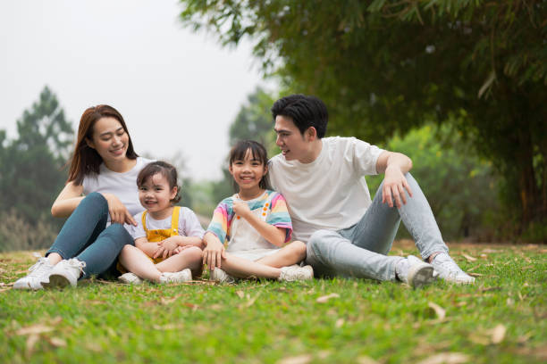 istock Young Asian family in the park 1490935504