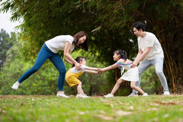 istock Young Asian family in the park 1490935531