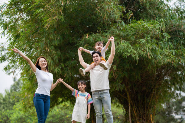 istock Young Asian family in the park 1490935761