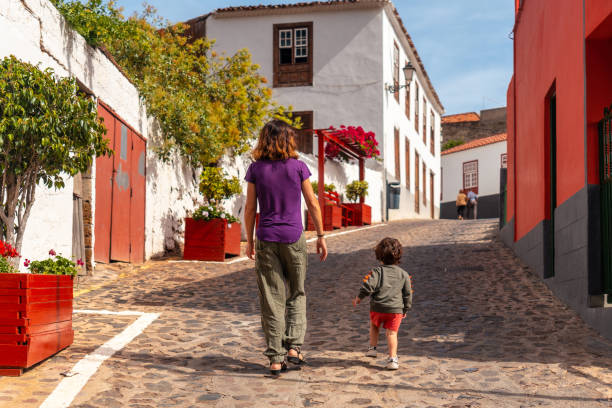 Mother and son visiting the village of Agulo in the north of La Gomera on vacation, Canary Islands Mother and son visiting the village of Agulo in the north of La Gomera on vacation, Canary Islands agulo stock pictures, royalty-free photos & images