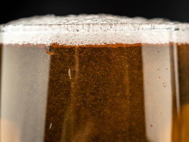 istock A glass of cold beer on a dark background. 1490938754