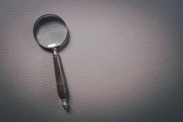 istock Magnifying glass on dark gray background 1490938770