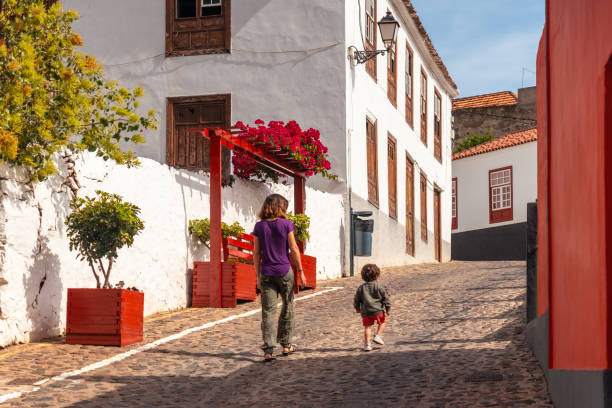 Mother and son visiting the village of Agulo in the north of La Gomera on vacation, Canary Islands Mother and son visiting the village of Agulo in the north of La Gomera on vacation, Canary Islands agulo stock pictures, royalty-free photos & images