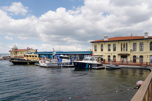 Izmir, Turkey - April 28 2023 : Sea police boats in front of historical port in Passport District.