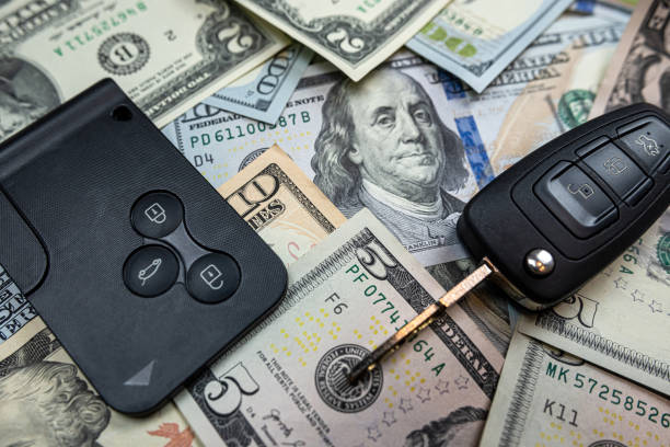istock us dollars banknotes and car keys or remote control for duy rent insurence auto 1490940353