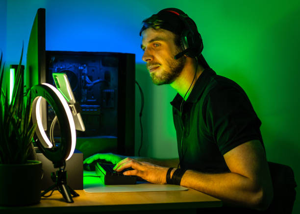 istock Man playing videogames  and streaming at home. 1490942201