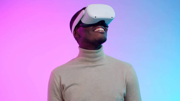 istock African-American man model in virtual reality headset isolated over neon background 1490942432