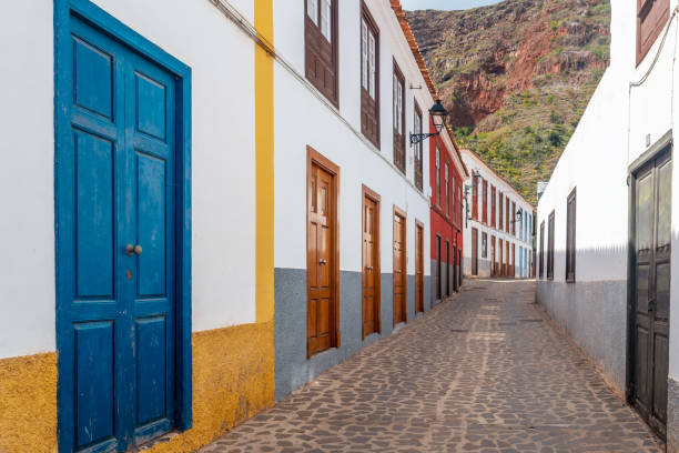 Colored doors and windows to the streets in the village of Agulo in the north of La Gomera in summer, Canary Islands Colored doors and windows to the streets in the village of Agulo in the north of La Gomera in summer, Canary Islands agulo stock pictures, royalty-free photos & images