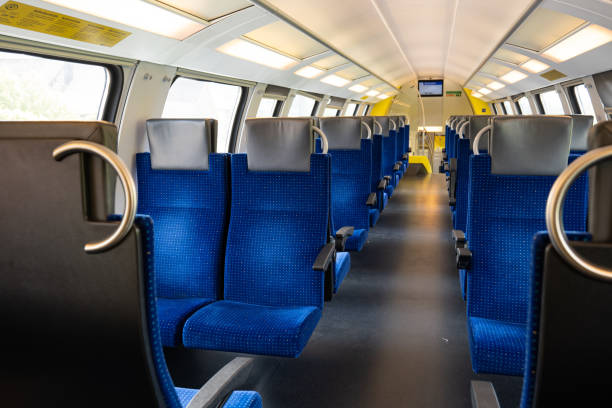 istock Empty seats on a passenger train in Europe. Wide-angle view, day time, no people 1490943020