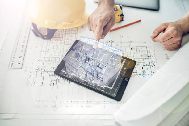 Construction professional showing a house project in virtual reality stock photo