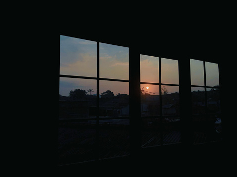 the silhouette of the true sun in the window and empty space image